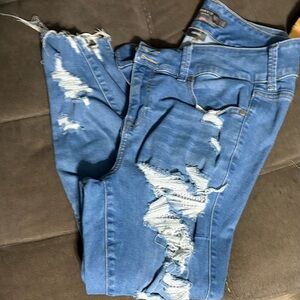 Torrid skinny jeans with fishnet behind